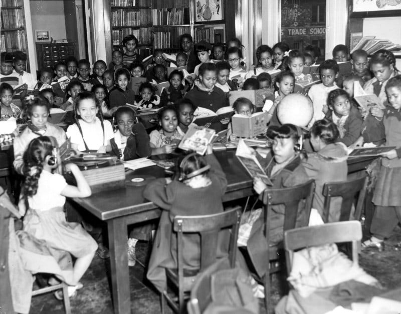 A photo of children reading at the Western branch in 1955