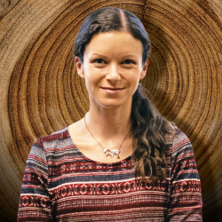 Dr. Maegen Rochner in front of a tree