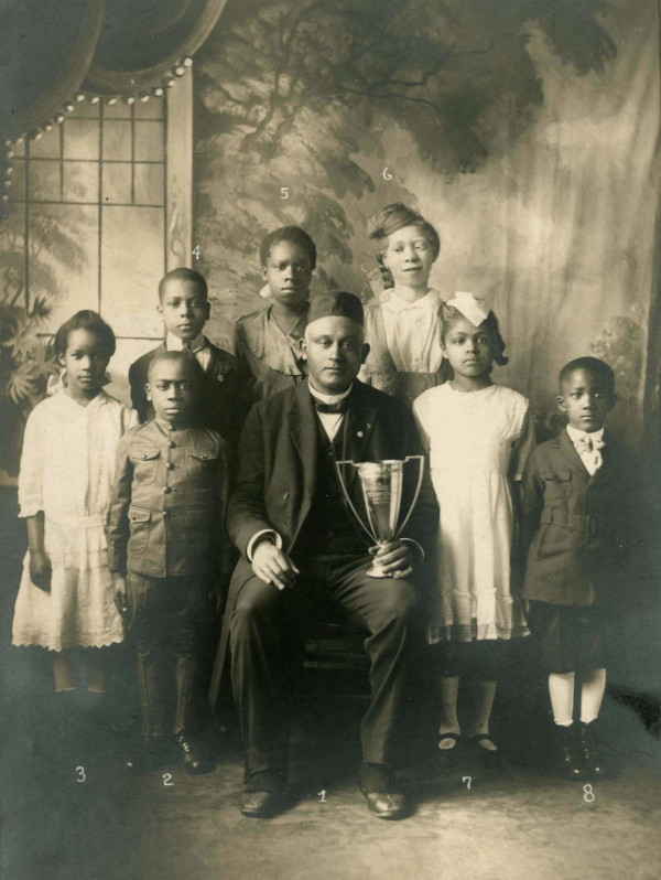 Joseph Cotter and students pose with the "Cotter Cup"