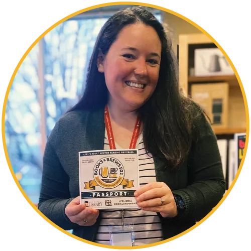 Woman holding a Books and Brews 502 Passport