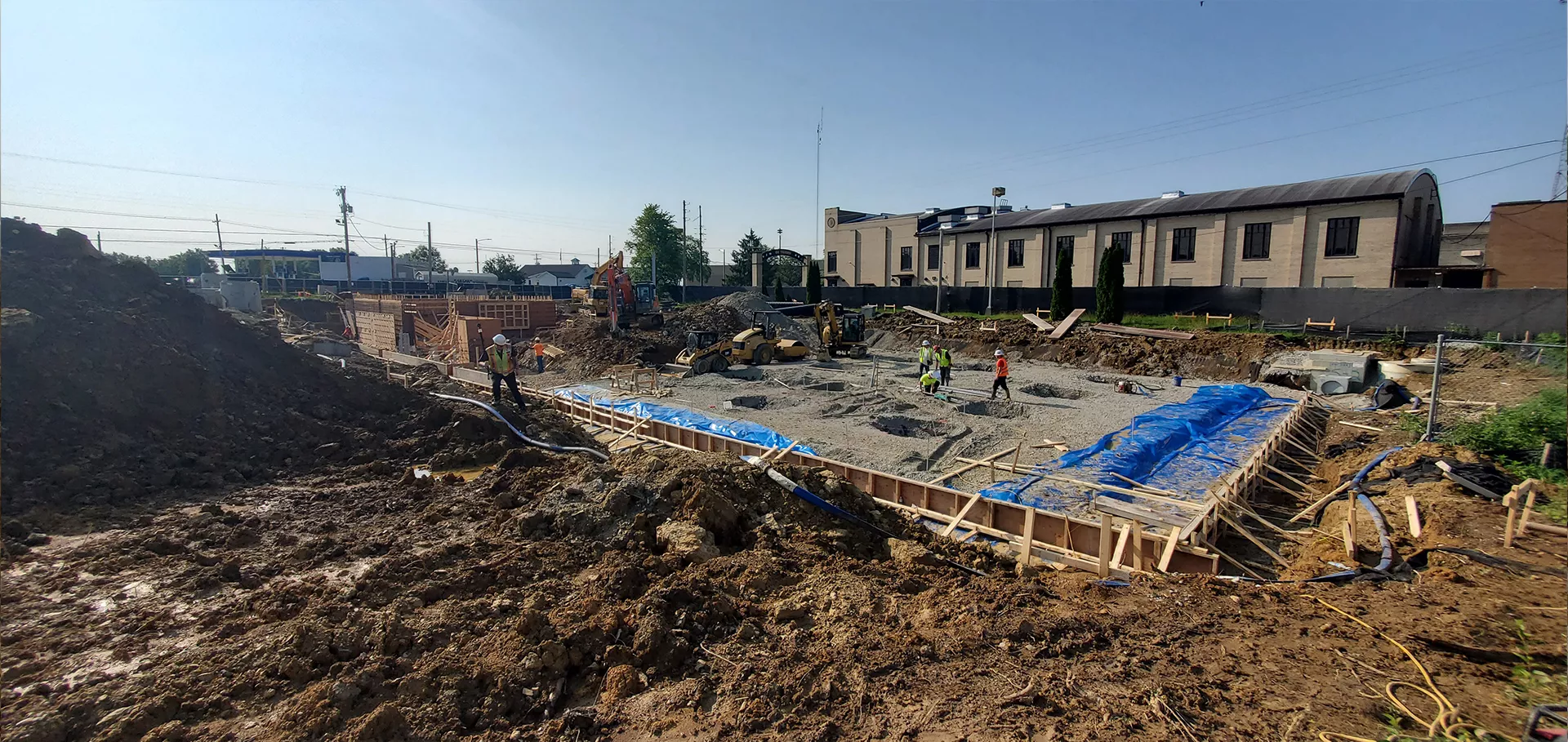 Construction workers laying foundation