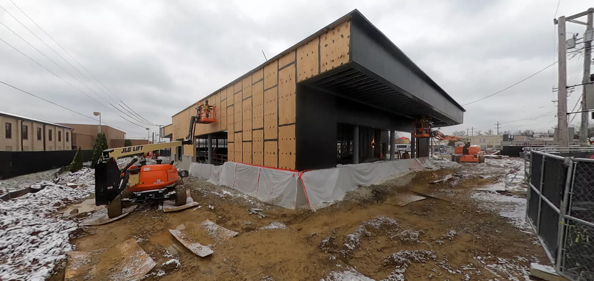 Workers working on the external wall  of the Fern Creek library