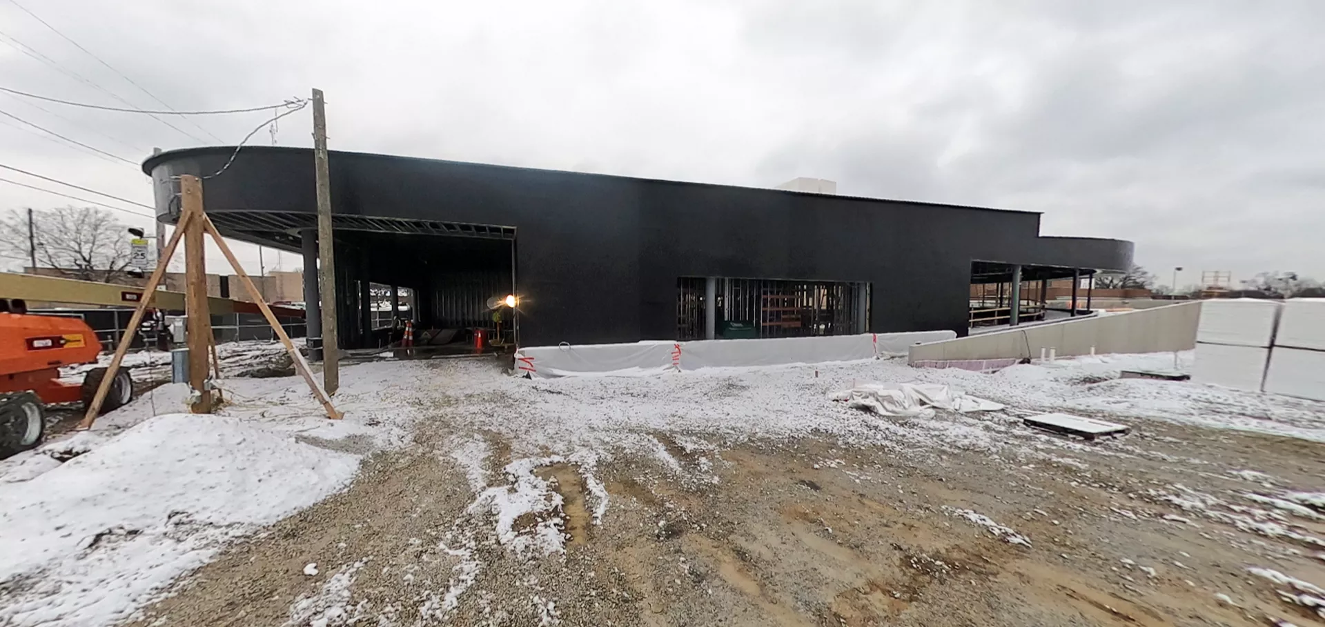 Side view of the outside of the building with black walls