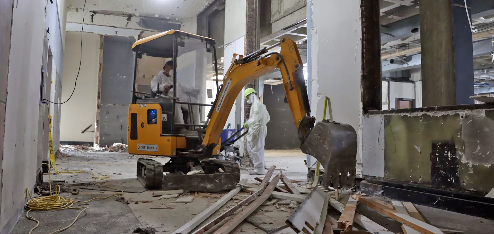 Construction workers with an excavator
