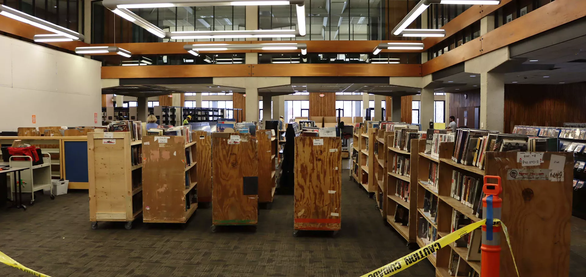 North lobby with books placed on wooden carts