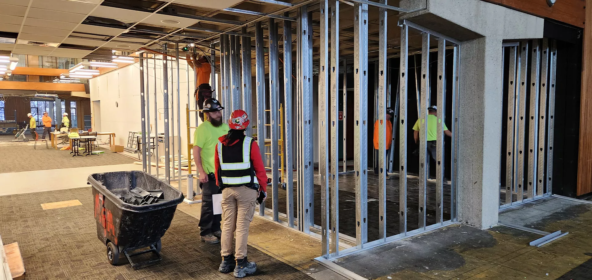 Construction workers working on the wiring on the 1st floor