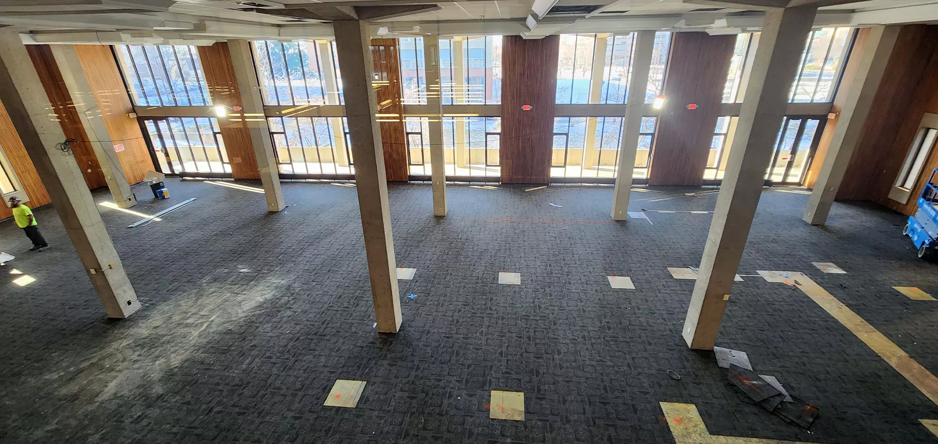 Cleared first floor of Main Library with concrete columns and windows overlooking 3rd street
