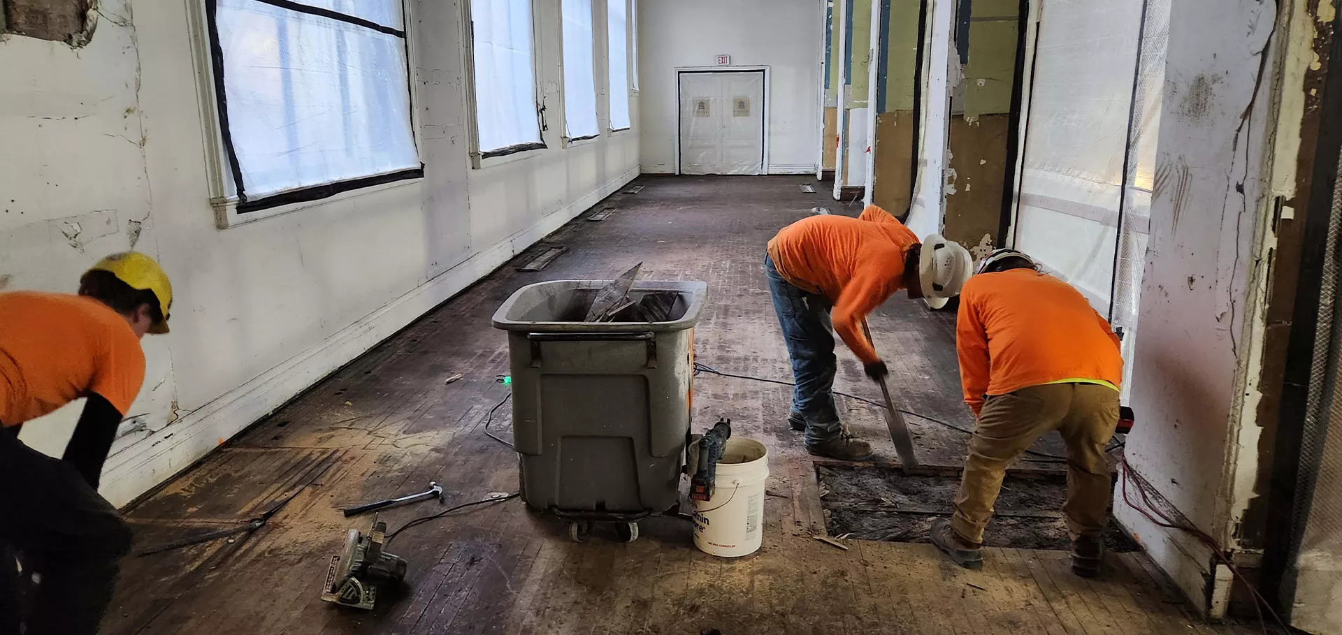 Workers removing sections of the flooring in the Bernheim gallery