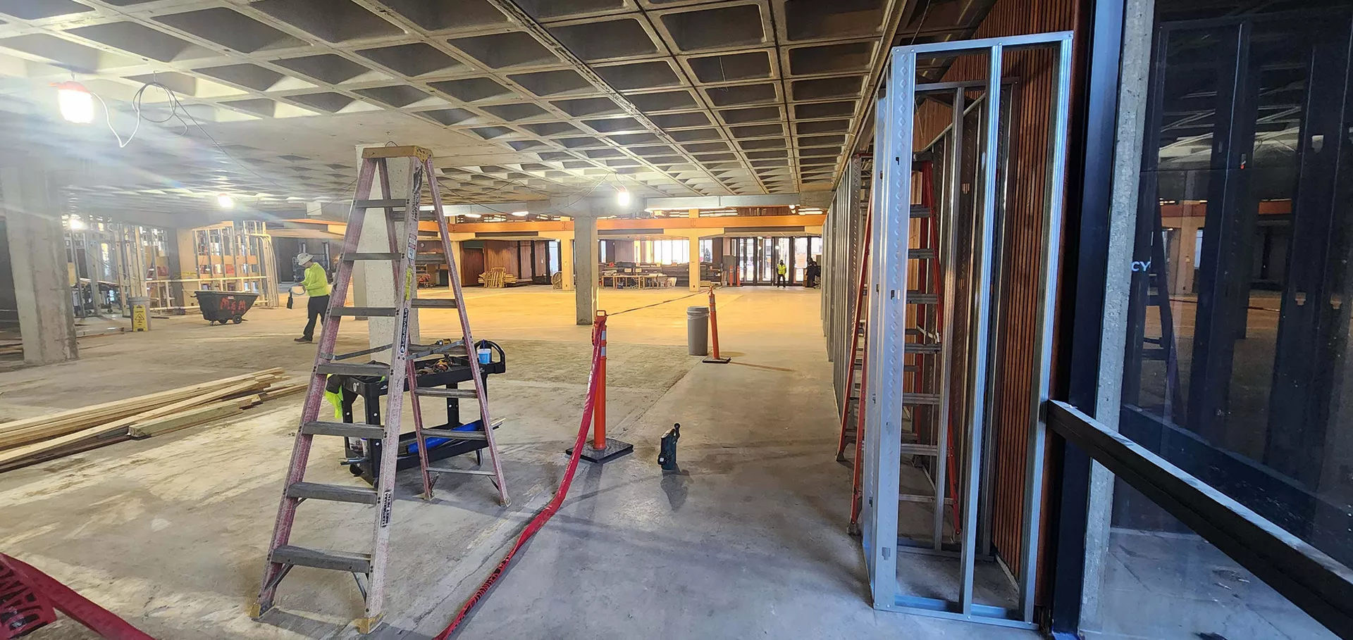Alternate angle of the Main Library's north lobby with construction workers 