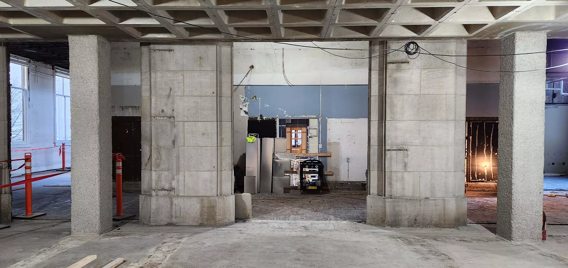 View from the North lobby to the south lobby with exposed concrete pillars