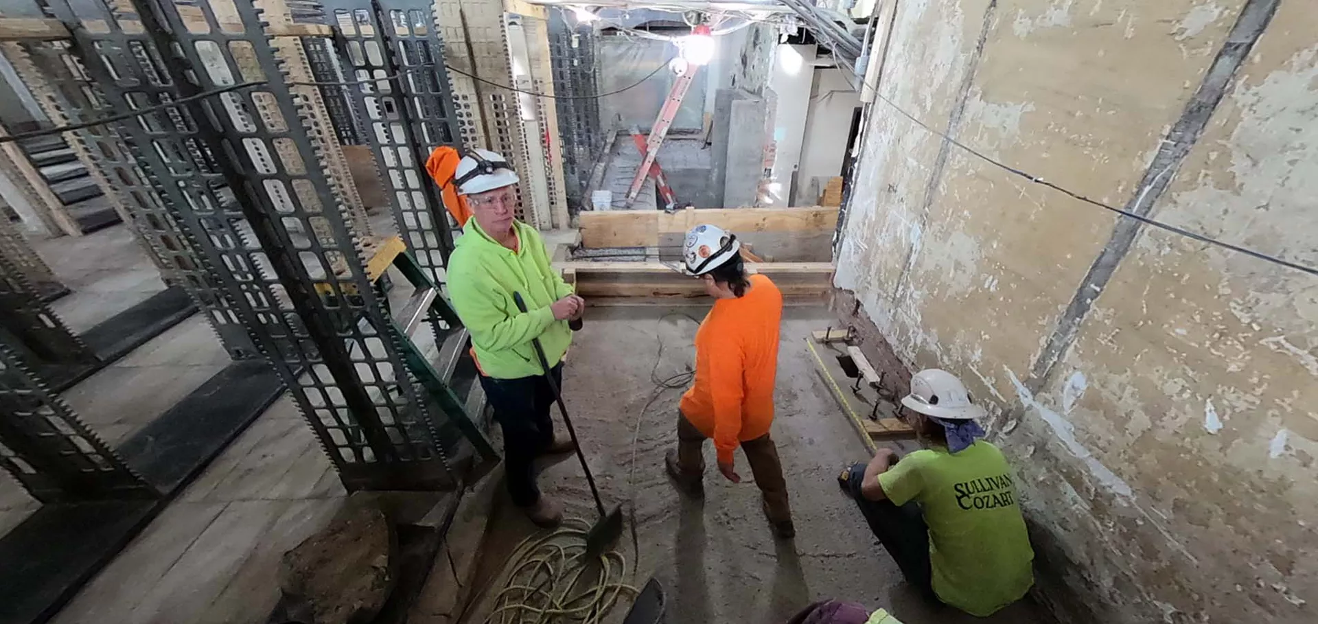 Construction workers working in the stacks area