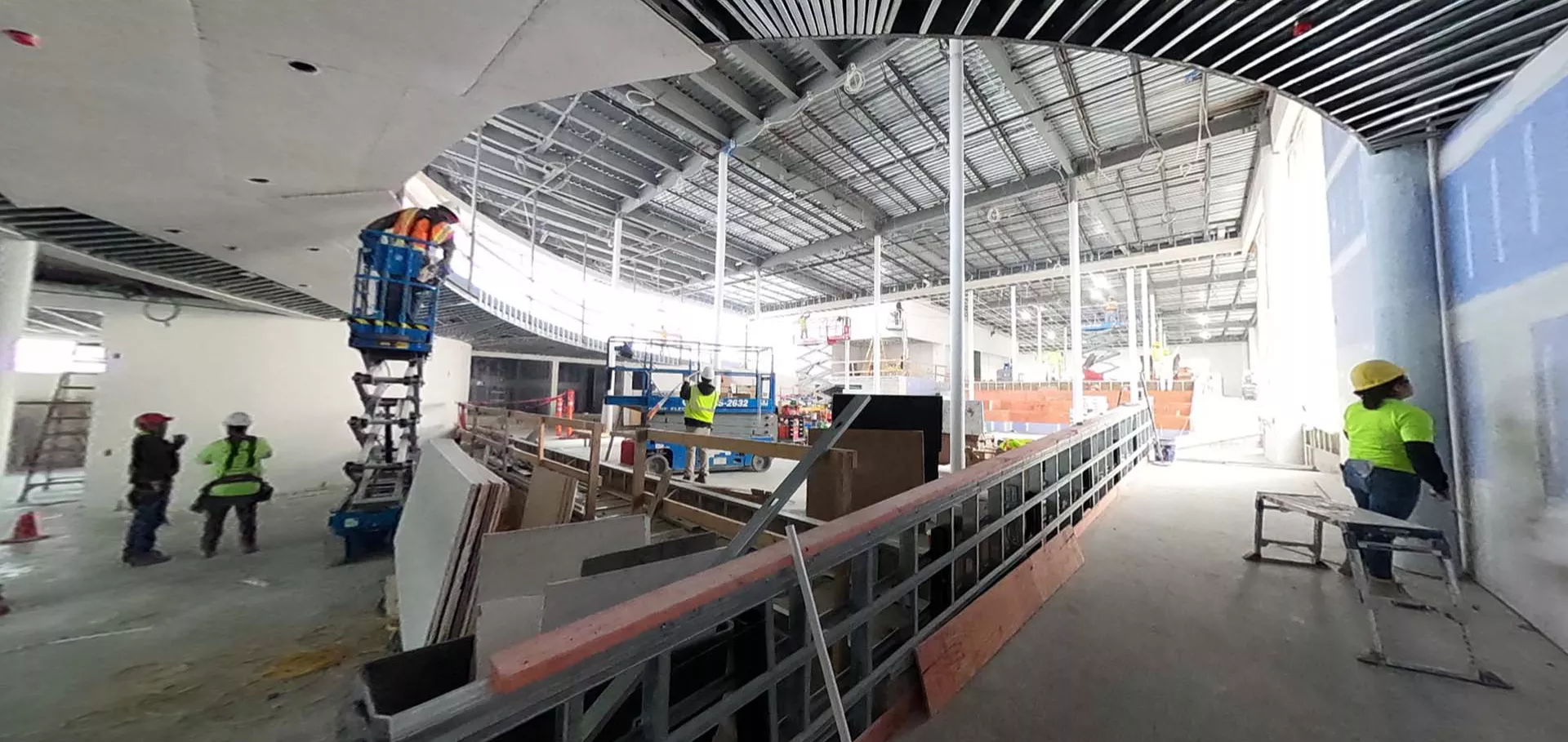 Construction workers inspecting the ceiling