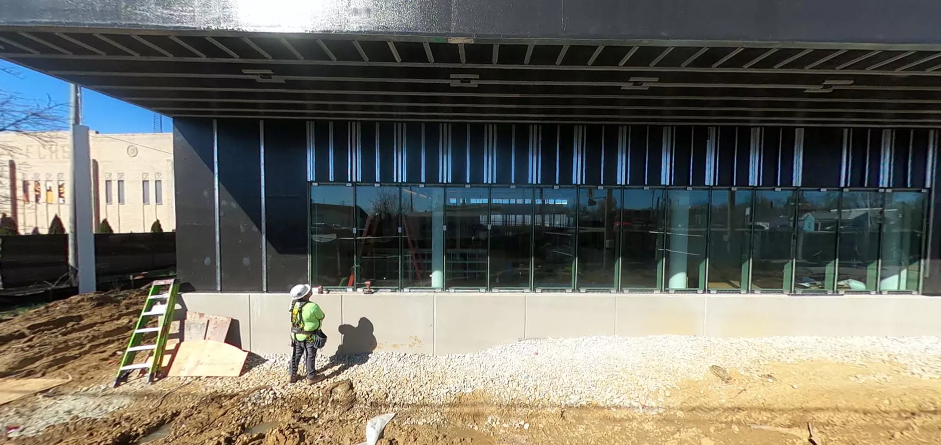 Construction worker looking at newly installed windows