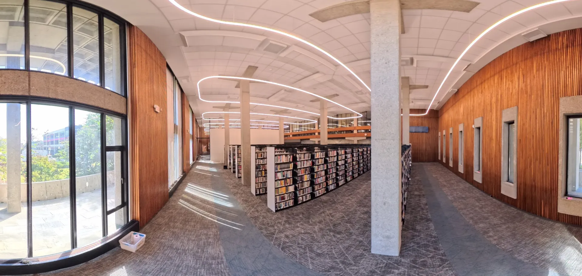 Corner view of library stacks with windows on either side