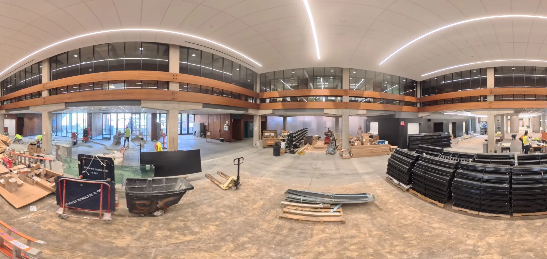 Center view of the north lobby with view of the Mezzanine floor and construction workers